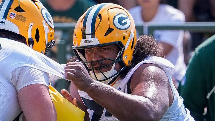 Green Bay Packers lineman John Williams (73) run through a drill during training camp. Green Bay Packers lineman John Williams (73) run through a drill during training camp.
