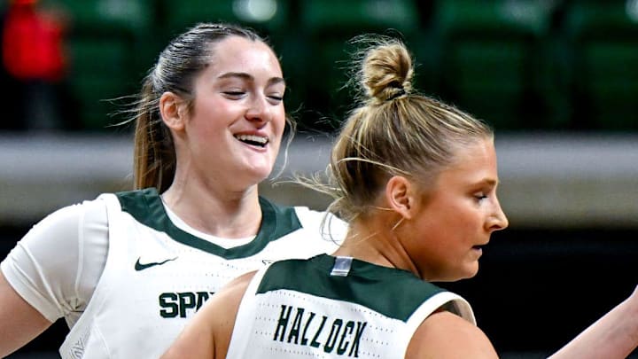 Michigan State's Grace VanSlooten, left, and Theryn Hallock celebrate a score against Wayne State during the first quarter on Monday, Oct. 28, 2024, in East Lansing.