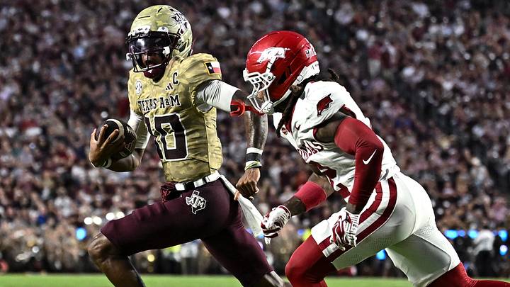Texas A&M Aggies quarterback Marcel Reed (10) runs the ball as Arkansas Razorbacks defensive back Shelton Lewis (2) defends during the first half at Kyle Field.