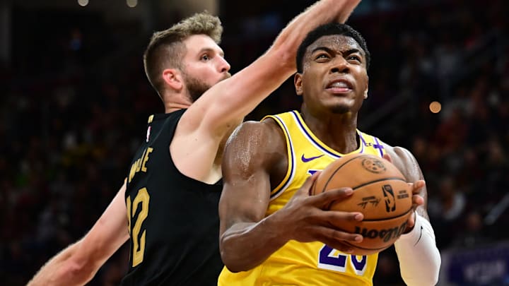 Oct 30, 2024; Cleveland, Ohio, USA; Los Angeles Lakers forward Rui Hachimura (28) drives to the basket against Cleveland Cavaliers forward Dean Wade (32) during the second half at Rocket Mortgage FieldHouse. Mandatory Credit: Ken Blaze-Imagn Images
