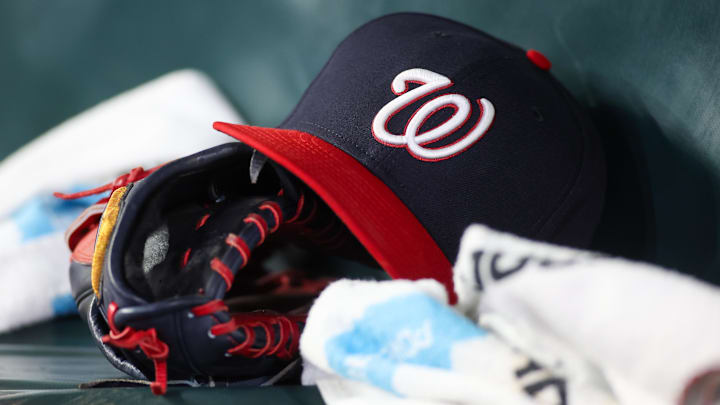 Dark blue Washington Nationals hat on top of a black mitt