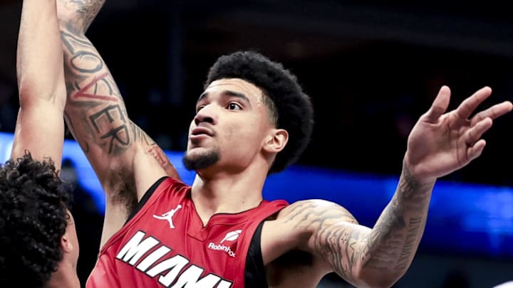 Feb 13, 2025; Dallas, Texas, USA; Miami Heat center Kel'el Ware (7) shoots over Dallas Mavericks guard Max Christie (00) during the second half at American Airlines Center. Mandatory Credit: Kevin Jairaj-Imagn Images