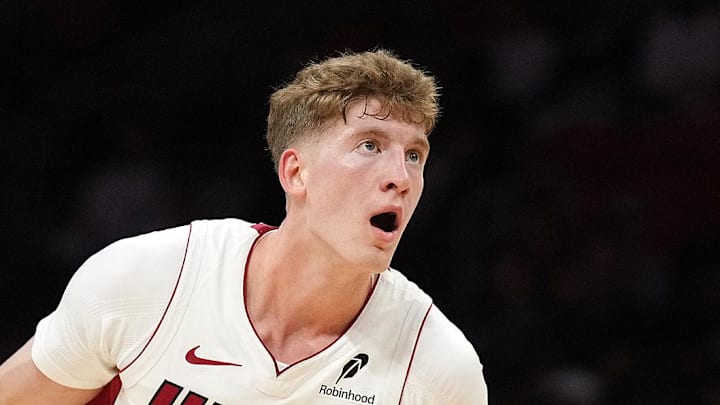 Oct 8, 2025; Miami, Florida, USA;  Miami Heat guard Kasparas Jakucionis (25) looks to pass the ball as San Antonio Spurs forward Harrison Barnes (40) defends in the first half at Kaseya Center. Mandatory Credit: Jim Rassol-Imagn Images