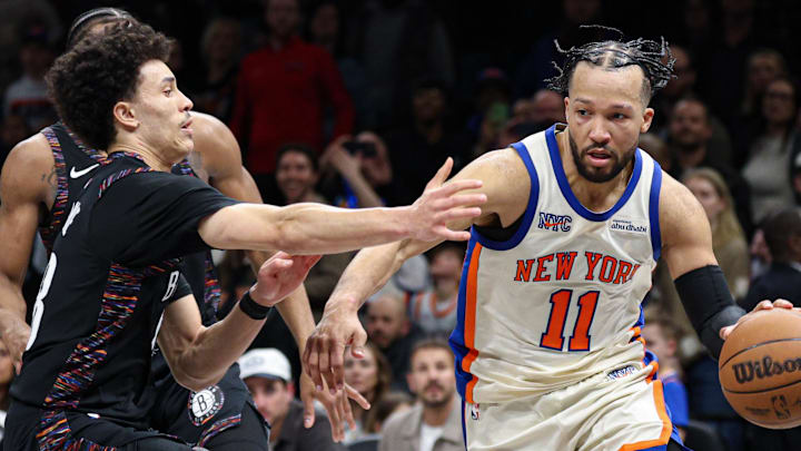 Mar 20, 2026; Brooklyn, New York, USA; New York Knicks guard Jalen Brunson (11) is fouled by Brooklyn Nets guard Nolan Traore (88) during the second half at Barclays Center. Mandatory Credit: Vincent Carchietta-Imagn Images
