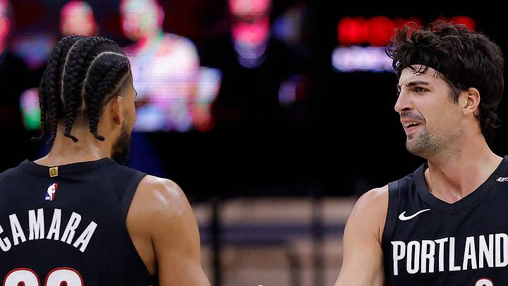 Portland Trail Blazers forward Toumani Camara and forward Deni Avdija high five after a play against the Sacramento Kings. Portland Trail Blazers forward Toumani Camara and forward Deni Avdija high five after a play against the Sacramento Kings.