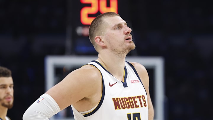 May 18, 2025; Oklahoma City, Oklahoma, USA; Denver Nuggets center Nikola Jokic (15) watches Oklahoma City Thunder guard Shai Gilgeous-Alexander shoot free throws in the second half of game seven of the second round for the 2025 NBA Playoffs at Paycom Center. Mandatory Credit: Alonzo Adams-Imagn Images