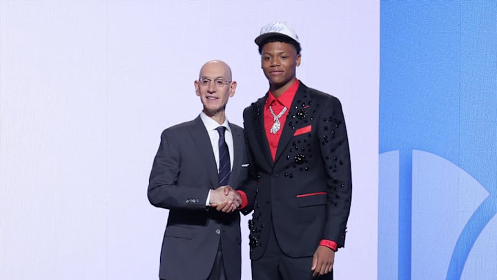 Jun 25, 2025; Brooklyn, NY, USA;  Ace Bailey stands with NBA commissioner Adam Silver after being selected as the fifth pick by the Utah Jazz in the first round of the 2025 NBA Draft at Barclays Center. Mandatory Credit: Brad Penner-Imagn Images