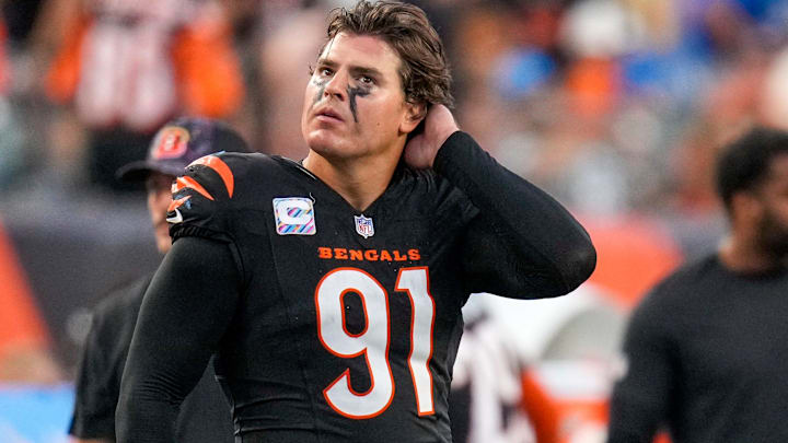 Cincinnati Bengals defensive end Trey Hendrickson (91) watches a replay as the Detroit Lions celebrate a touchdown in the fourth quarter of the NFL Week 5 game between the Cincinnati Bengals and the Detroit Lions at Paycor Stadium in downtown Cincinnati on Sunday, Oct. 5, 2025. The Bengals continued a losing streak, falling 37-24 to the Lions.