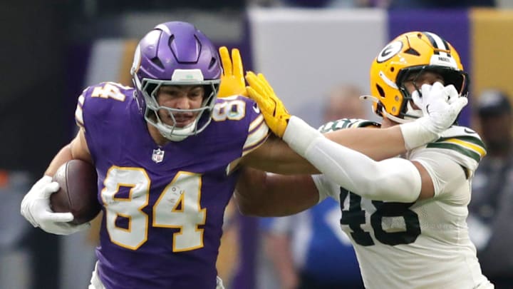 Minnesota Vikings tight end Josh Oliver, Green Bay Packers linebacker Jamon Johnson