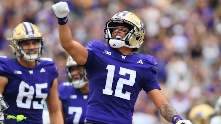 Washington Huskies wide receiver Denzel Boston  celebrates after catching a touchdown against the Eastern Michigan Eagles.