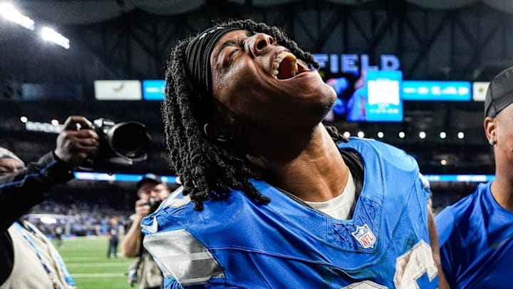 Detroit Lions running back Jahmyr Gibbs (26) and running back David Montgomery (5) celebrate 34-31 win over Green Bay Packers as he exits the field at Ford Field in Detroit on Thursday, Dec. 5, 2024.