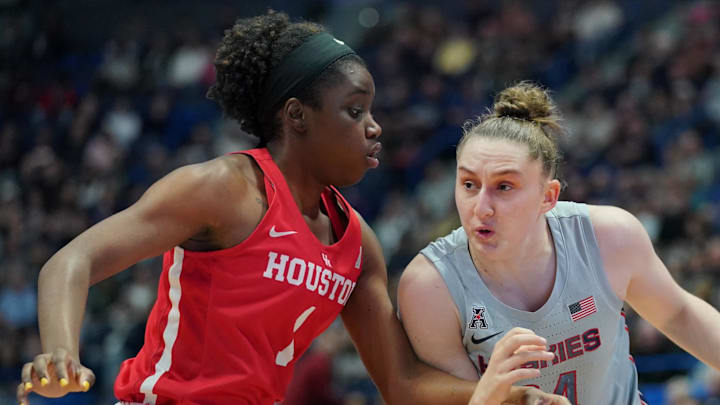 Jan 11, 2020; Hartford, Connecticut, USA; UConn Huskies guard Anna Makurat (24) drives the ball against Houston Cougars forward Bria Patterson (1) in the 1st half at XL Center. Mandatory Credit: David Butler II-Imagn Images