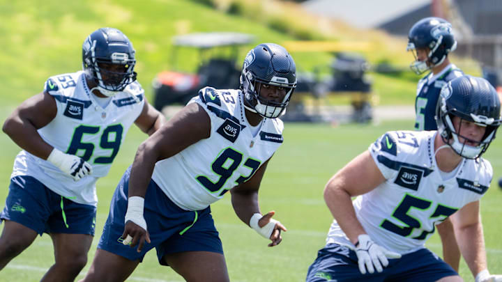 Jun 11, 2025; Renton, WA, USA; Seattle Seahawks defensive lineman Anthony Campbell (93) defensive lineman Bubba Thomas (69) and linebacker Connor O'Toole (57) take part in drills during mini-camp at Virginia Mason Athletic Center. Mandatory Credit: Stephen Brashear-Imagn Images Jun 11, 2025; Renton, WA, USA; Seattle Seahawks defensive lineman Anthony Campbell (93) defensive lineman Bubba Thomas (69) and linebacker Connor O'Toole (57) take part in drills during mini-camp at Virginia Mason Athletic Center. Mandatory Credit: Stephen Brashear-Imagn Images