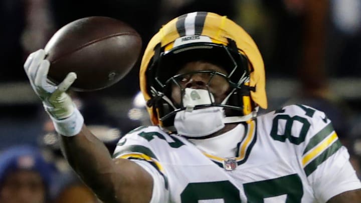 Green Bay Packers receiver Romeo Doubs (87) pulls down a one-handed catch against the Bears in the playoffs.