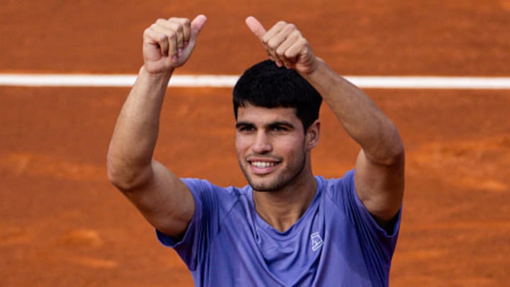 Carlos Alcaraz reacts to winning a match at the Barcelona Open.