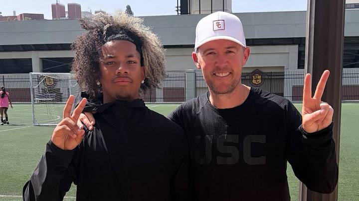 Victor Valley (Calif.) 2029 running back Makai Buchanan and USC Trojans head coach Lincoln Riley Victor Valley (Calif.) 2029 running back Makai Buchanan and USC Trojans head coach Lincoln Riley