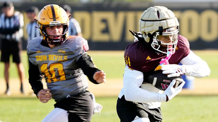 Arizona State Sun Devils quarterback Sam Leavitt (10) hands the ball to running back Kyson Brown (2) during workouts at Kajikawa Practice fields on Dec. 20, 2024.