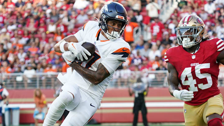 Aug 9, 2025; Santa Clara, California, USA; Denver Broncos wide receiver Devaughn Vele (17) make a reception in the second quarter against San Francisco 49ers linebacker Nick Martin (45) at Levi's Stadium.