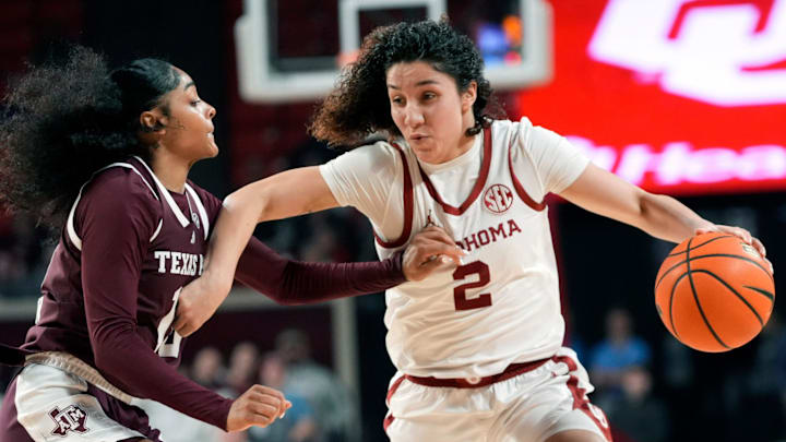 Oklahoma's Aaliyah Chavez (2) drives to the basket as Texas A&M's Lemyah Hylton (10) defends during the women's college basketball game between the Oklahoma Sooners and the Texas A&M Aggies at the Lloyd Noble Center in Norman, Okla., Thursday Jan. 29, 2026.