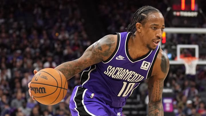 Nov 24, 2024; Sacramento, California, USA; Sacramento Kings forward DeMar DeRozan (10) dribbles against Brooklyn Nets guard Keon Johnson (45) during the third quarter at Golden 1 Center. 