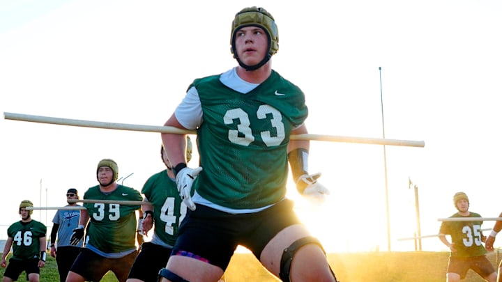 Basha offensive tackle Jake Hildebrand runs a drill during a practice at Basha High School on April 25, 2024.