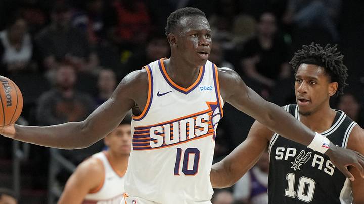 Oct 10, 2026; Phoenix, Arizona, USA;  Phoenix Suns center Khaman Maluach (10) shields the ball from San Antonio Spurs center Tarris Reed Jr. (10) in the second half at Mortgage Matchup Center.  Mandatory Credit: Rick Scuteri-Imagn Images