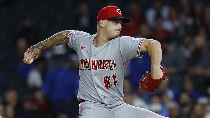 Cincinnati Reds starting pitcher Chase Petty (61) delivers a pitch