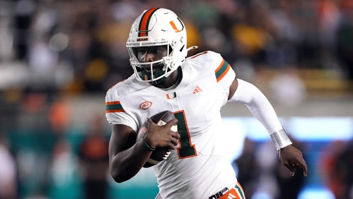 Oct 5, 2024; Berkeley, California, USA; Miami Hurricanes quarterback Cam Ward (1) rushes for a touchdown /across the/ during the fourth quarter at California Memorial Stadium. 