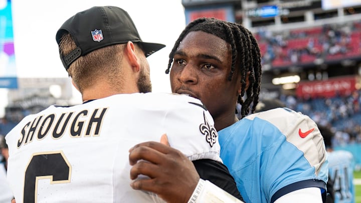 Tennessee Titans quarterback Cam Ward (1) hugs New Orleans Saints quarterback Tyler Shough (6) after the Saints won 34-26 at Nissan Stadium in Nashville, Tenn., Sunday, Dec. 28, 2025.