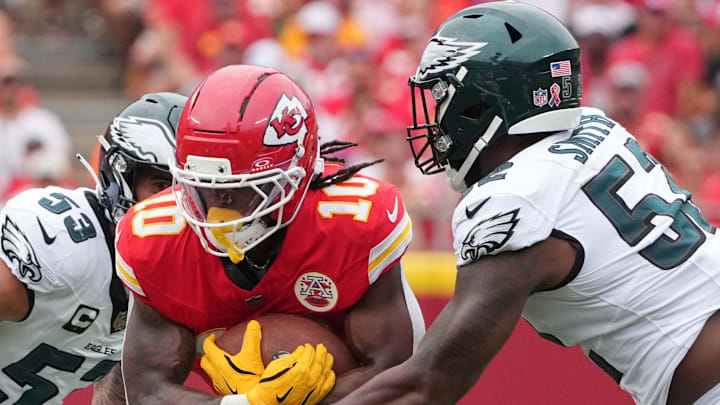 Sep 14, 2025; Kansas City, Missouri, USA; Philadelphia Eagles defensive end Za'Darius Smith (52) tackles Kansas City Chiefs running back Isiah Pacheco (10) during the second quarter of the game at GEHA Field at Arrowhead Stadium. Mandatory Credit: Denny Medley-Imagn Images