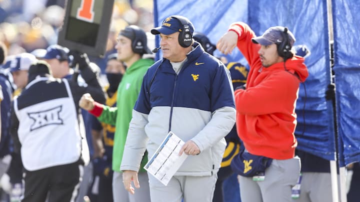 Nov 29, 2025; Morgantown, West Virginia, USA; West Virginia Mountaineers head coach Rich Rodriguez walks along the sidelines during the first quarter against the Texas Tech Red Raiders at Milan Puskar Stadium. Mandatory Credit: Ben Queen-Imagn Images