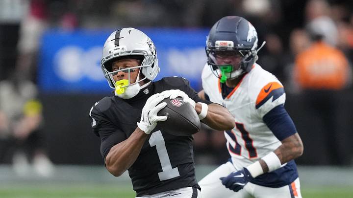 Dec 7, 2025; Paradise, Nevada, USA;  Las Vegas Raiders wide receiver Tre Tucker (1) makes the catch as Denver Broncos cornerback Kris Abrams-Draine (31) defends.