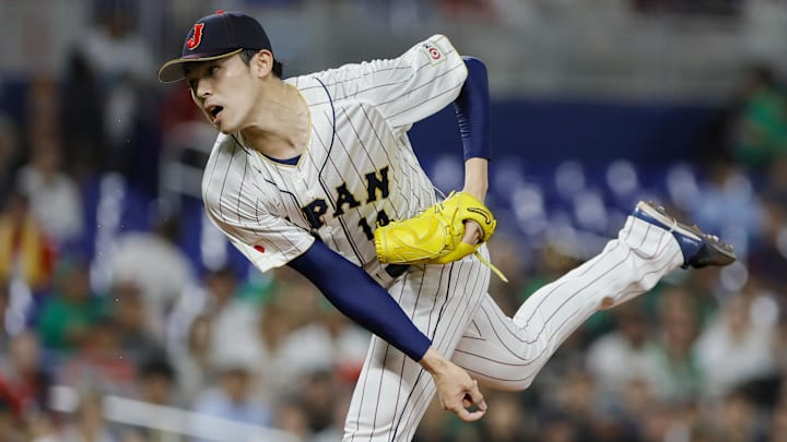 Mar 20, 2023; Miami, Florida, USA; Japan starting pitcher Roki Sasaki (14) delivers a pitch during the first inning against Mexico at LoanDepot Park