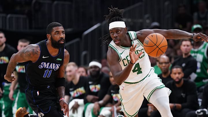 Jun 6, 2024; Boston, Massachusetts, USA; Boston Celtics guard Jrue Holiday (4) controls the ball against Dallas Mavericks guard Kyrie Irving (11) in the third quarter during game one of the 2024 NBA Finals at TD Garden. Mandatory Credit: David Butler II-USA TODAY Sports Jun 6, 2024; Boston, Massachusetts, USA; Boston Celtics guard Jrue Holiday (4) controls the ball against Dallas Mavericks guard Kyrie Irving (11) in the third quarter during game one of the 2024 NBA Finals at TD Garden. Mandatory Credit: David Butler II-USA TODAY Sports