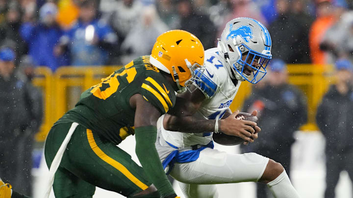 Green Bay Packers linebacker Edgerrin Cooper pursues Detroit Lions wide receiver Tim Patrick.