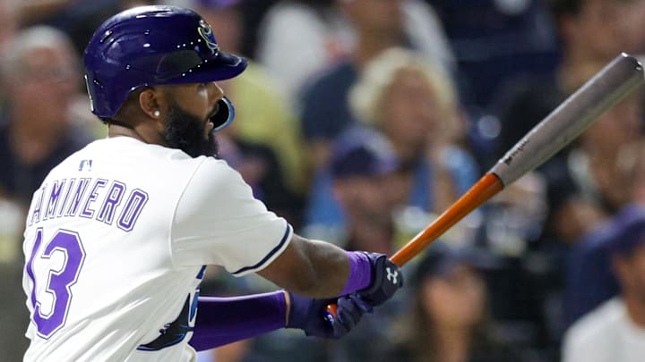 Jul 19, 2025; Tampa, Florida, USA; Tampa Bay Rays third baseman Junior Caminero (13) doubles against the Baltimore Orioles in the seventh inning at George M. Steinbrenner Field.