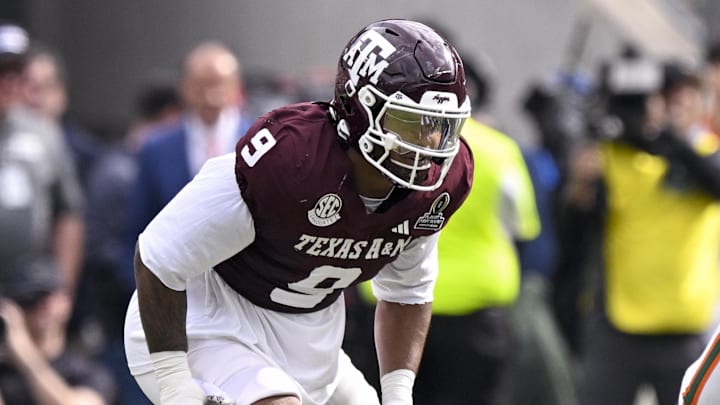 Dec 20, 2025; College Station, TX, USA; Texas A&M Aggies defensive end Cashius Howell (9) lines up during the game between the Aggies and the Hurricanes at Kyle Field. Mandatory Credit: Jerome Miron-Imagn Images