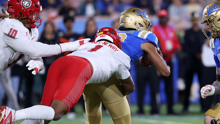 Sep 12, 2025; Pasadena, California, USA; UCLA Bruins quarterback Nico Iamaleava (9) is sacked by New Mexico Lobos defensive tackle Keyshawn James-Newby (1) during the first half at Rose Bowl. Mandatory Credit: Kiyoshi Mio-Imagn Images Sep 12, 2025; Pasadena, California, USA; UCLA Bruins quarterback Nico Iamaleava (9) is sacked by New Mexico Lobos defensive tackle Keyshawn James-Newby (1) during the first half at Rose Bowl. Mandatory Credit: Kiyoshi Mio-Imagn Images