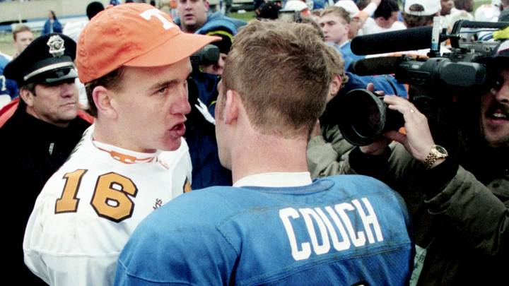 Tennessee quarterback Peyton Manning (16), left, talks with Kentucky quarterback Tim Couch (2) after the 5th-ranked Vols defeated the Wildcats 59-31 at Commonwealth Stadium in Lexington, Ky., Nov. 22, 1997.