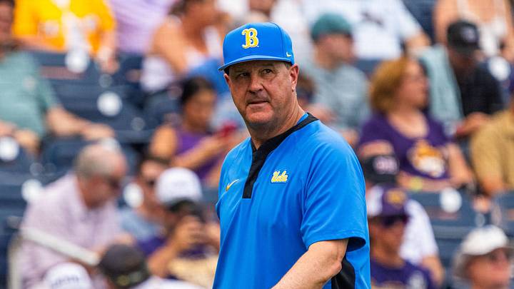 Jun 16, 2025; Omaha, Neb, USA; UCLA Bruins head coach John Savage walks off the field before the game against the LSU Tigers at Charles Schwab Field. Mandatory Credit: Dylan Widger-Imagn Images Jun 16, 2025; Omaha, Neb, USA; UCLA Bruins head coach John Savage walks off the field before the game against the LSU Tigers at Charles Schwab Field. Mandatory Credit: Dylan Widger-Imagn Images