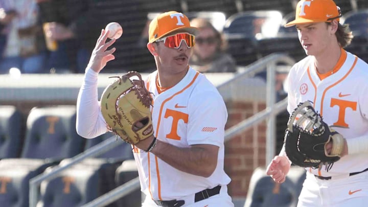 Tennessee first baseman Alberto Osuna (45) tosses the ball up while warming up at the Tennessee baseball season opener against Hofstra, in Lindsey Nelson Stadium at University of Tennessee in Knoxville, Tenn., Friday, February. 14, 2025.