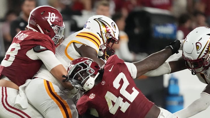 Sep 6, 2025; Tuscaloosa, Alabama, USA;  Alabama linebacker Bray Hubbard (18) and Alabama linebacker Yhonzae Pierre (42) combine to make a tackle on UL Monroe running back D'Shaun Ford (22) at Saban Field at Bryant-Denny Stadium. Alabama defeated UL Monroe 73-0. Mandatory Credit: Gary Cosby Jr.-Imagn Images