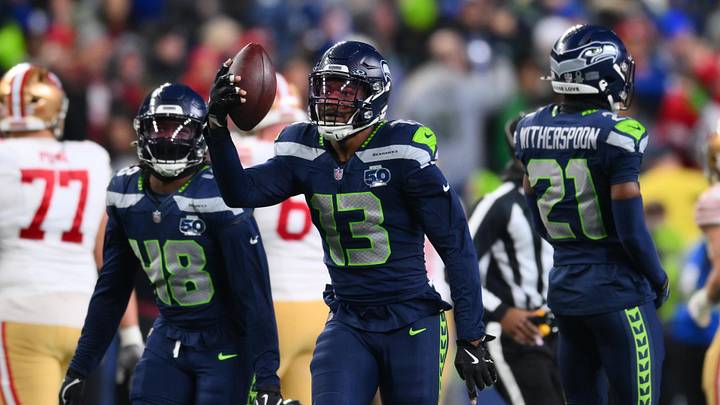 Jan 17, 2026; Seattle, WA, USA; Seattle Seahawks linebacker Ernest Jones IV (13) reacts after an interception against the San Francisco 49ers during the second half in an NFC Divisional Round game at Lumen Field. Mandatory Credit: Steven Bisig-Imagn Images