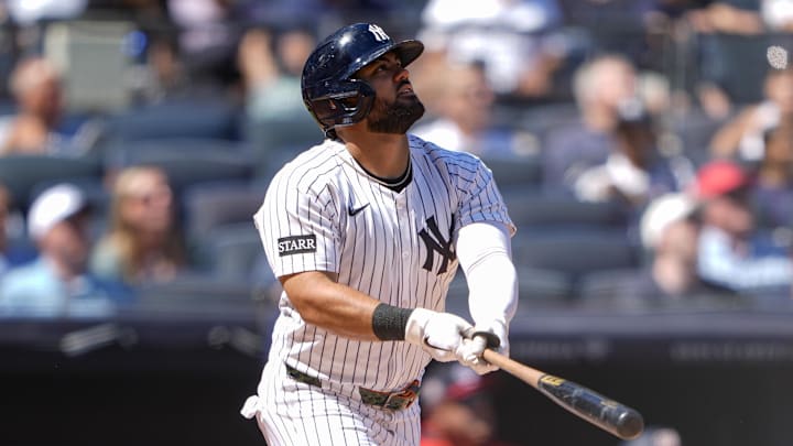 Aug 27, 2025; Bronx, New York, USA; New York Yankees left fielder Jasson Dominguez (24) hits a double against the Washington Nationals during the third inning at Yankee Stadium. Mandatory Credit: Gregory Fisher-Imagn Images
