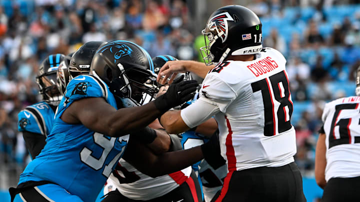 Carolina Panthers defensive tackle T.J. Smith pressures as Atlanta Falcons quarterback Kirk Cousins makes a throw. Mandatory Credit: Bob Donnan-Imagn Images Carolina Panthers defensive tackle T.J. Smith pressures as Atlanta Falcons quarterback Kirk Cousins makes a throw. Mandatory Credit: Bob Donnan-Imagn Images