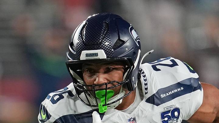 Seattle Seahawks running back Zach Charbonnet carries the ball
