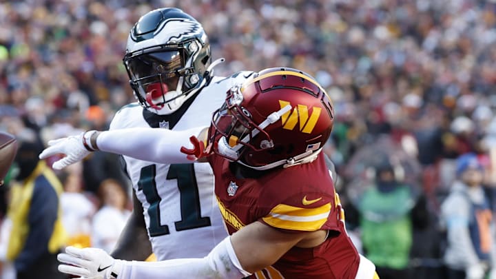 Dec 22, 2024; Landover, Maryland, USA; Washington Commanders cornerback Marshon Lattimore (23) defends a pass intended for Philadelphia Eagles wide receiver A.J. Brown (11) during the first quarter at Northwest Stadium. Mandatory Credit: Geoff Burke-Imagn Images