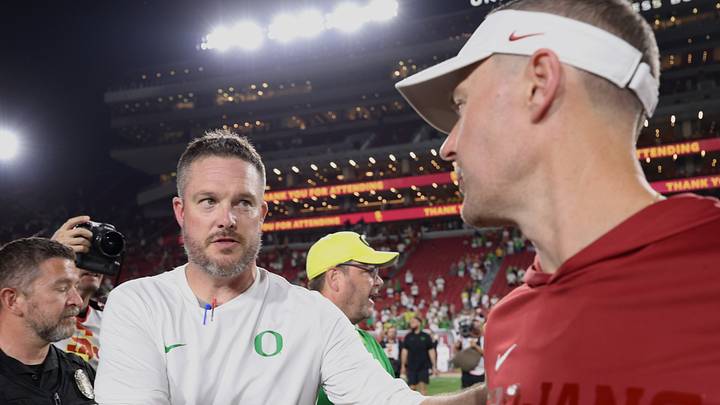 Sep 26, 2026; Los Angeles, California, USA; Oregon Ducks head coach Dan Lanning (left) shakes hands with USC Trojans head coach Lincoln Riley after the game at United Airlines Field at Los Angeles Memorial Coliseum. Sep 26, 2026; Los Angeles, California, USA; Oregon Ducks head coach Dan Lanning (left) shakes hands with USC Trojans head coach Lincoln Riley after the game at United Airlines Field at Los Angeles Memorial Coliseum.