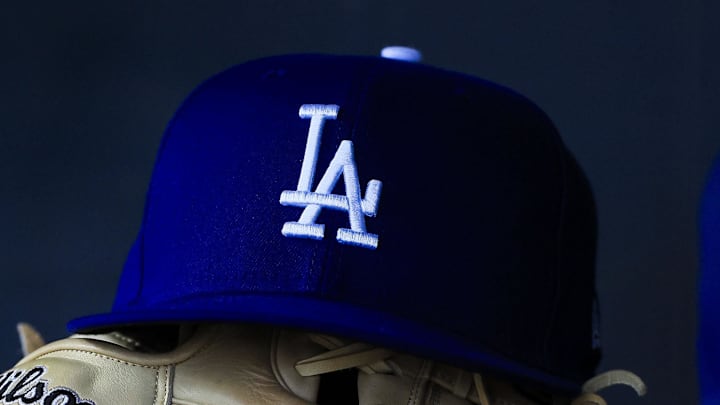 Jul 30, 2025; Cincinnati, Ohio, USA; A general view of a Los Angeles Dodgers hat and glove during the second inning in the game against the Cincinnati Reds at Great American Ball Park. 