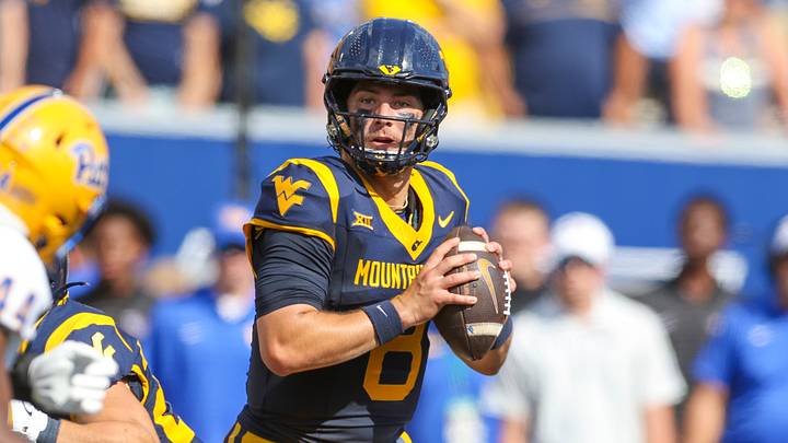 Sep 13, 2025; Morgantown, West Virginia, USA; West Virginia Mountaineers quarterback Nicco Marchiol (8) drops back to pass during the first quarter against the Pittsburgh Panthers at Milan Puskar Stadium. Mandatory Credit: Ben Queen-Imagn Images Sep 13, 2025; Morgantown, West Virginia, USA; West Virginia Mountaineers quarterback Nicco Marchiol (8) drops back to pass during the first quarter against the Pittsburgh Panthers at Milan Puskar Stadium. Mandatory Credit: Ben Queen-Imagn Images